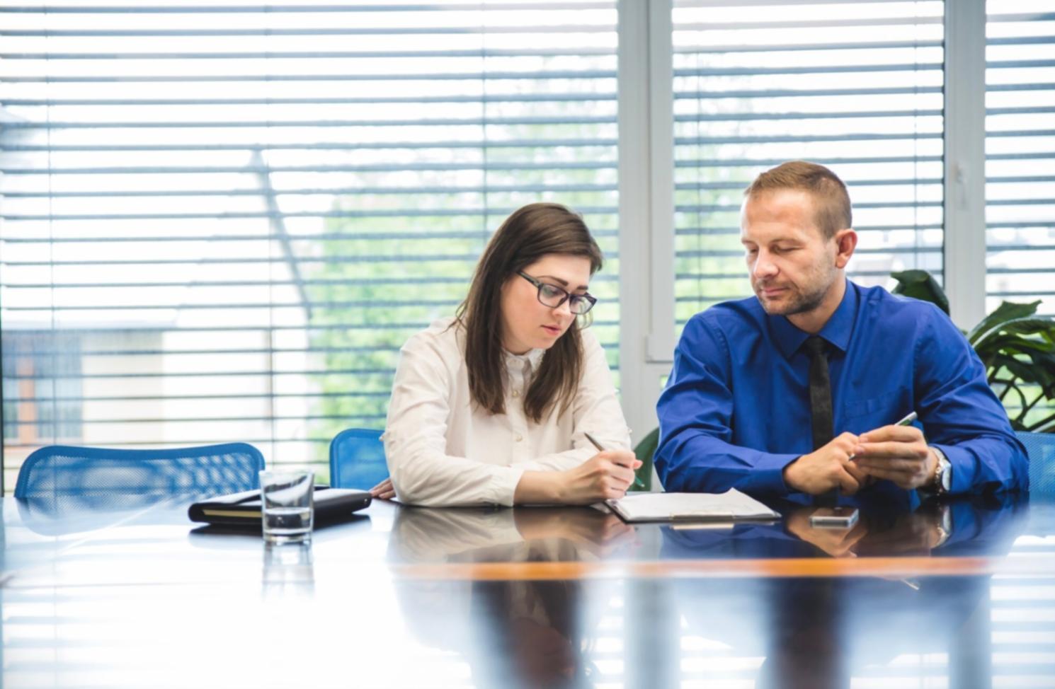 Business owner reviewing financial records at desk